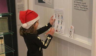 A child completing the Snowball Trail at the Dylan Thomas Centre