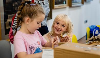Two young children in an art workshop