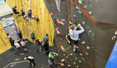 A group of teenagers learning to climb
