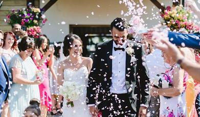 Oldwalls Gower married couple getting showered with confetti