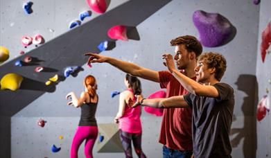 People near a climbing wall.