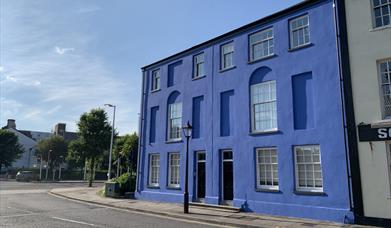 Exterior of a Georgian building painted blue.