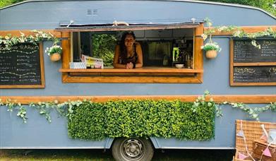 The Touring Tea Room with owner behind the bar