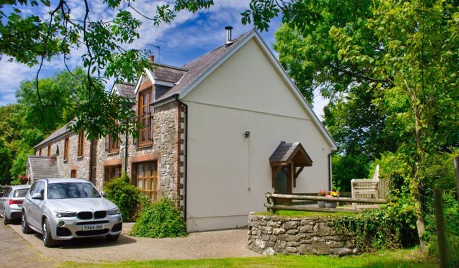 Hael Farm Cottages exterior with driveway