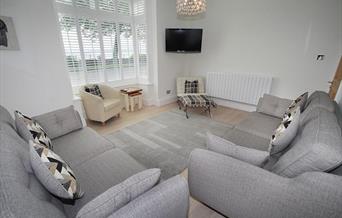 Promenade View living area with sofas and tv