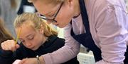 Craftsea instructor teaching student