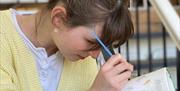 Craftsea person painting china mugs