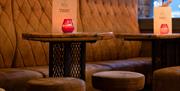 Brewstone seating area in evening with cocktail menus