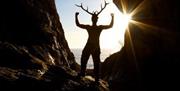 Dryad Bushcraft man standing in cave
