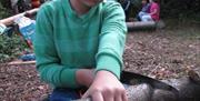 Dryad Bushcraft young boy cutting wood