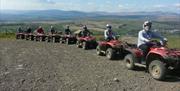 Dulais Valley Quads group of quadbikers on hill