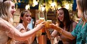 Founders & Co customers toasting glasses