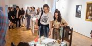 Glynn Vivian Art Gallery visitors exploring exhibition
