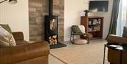 Hael Farm Cottages living area with fireplace