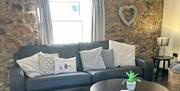 Hael Farm Cottages living area with sofa