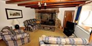 Horton Farmhouse living area with sofas and tv