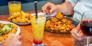 Lolis Mediterranean Restaurant customers eating and drinking