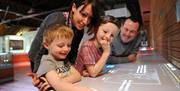 National Waterfront Museum family exploring exhibition