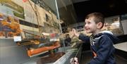 National Waterfront Museum young boy exploring displays