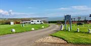 Newpark Holiday Park entrance with view of the bay