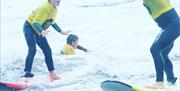 Progress Surf School children learning to surf