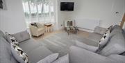 Promenade View living area with sofas and tv