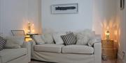 Promenade View sofas with lamps and artwork