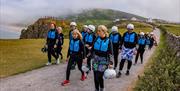 Savage Adventures tour group walking along clifftop
