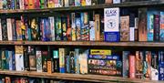 Socialdice shelves filled with board games