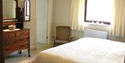 Bedroom with traditional furniture.