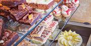 The Secret Beach Bar fridge filled with fresh desserts and cakes