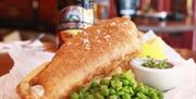 The Welsh House fish and chips with bottle of ale