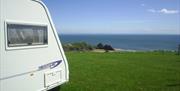 Three cliffs bay holiday park caravan on coastline