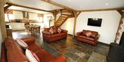 Tir-Cethin Farm Luxury Barn Holidays living area with sofas