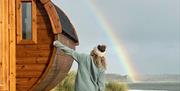 Ty Sawna sauna pod with rainbow in background